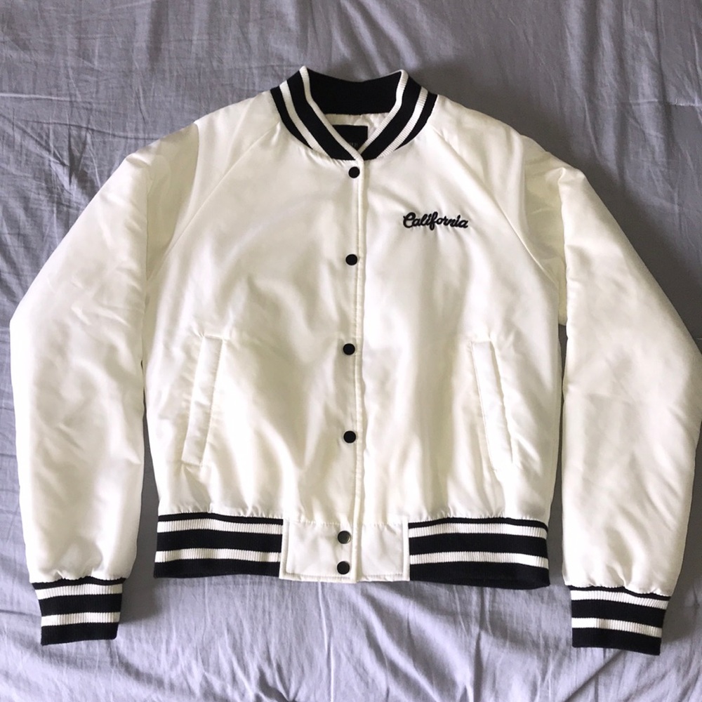 A California white puffer varsity jacket.